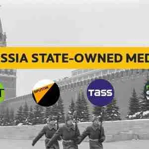 screenshot from linked video - marching Russian soldiers in Red Square - text onscreen: "Russia State-owned media" and logos of RT, TASS, SPUTNIK, and RUPTLY