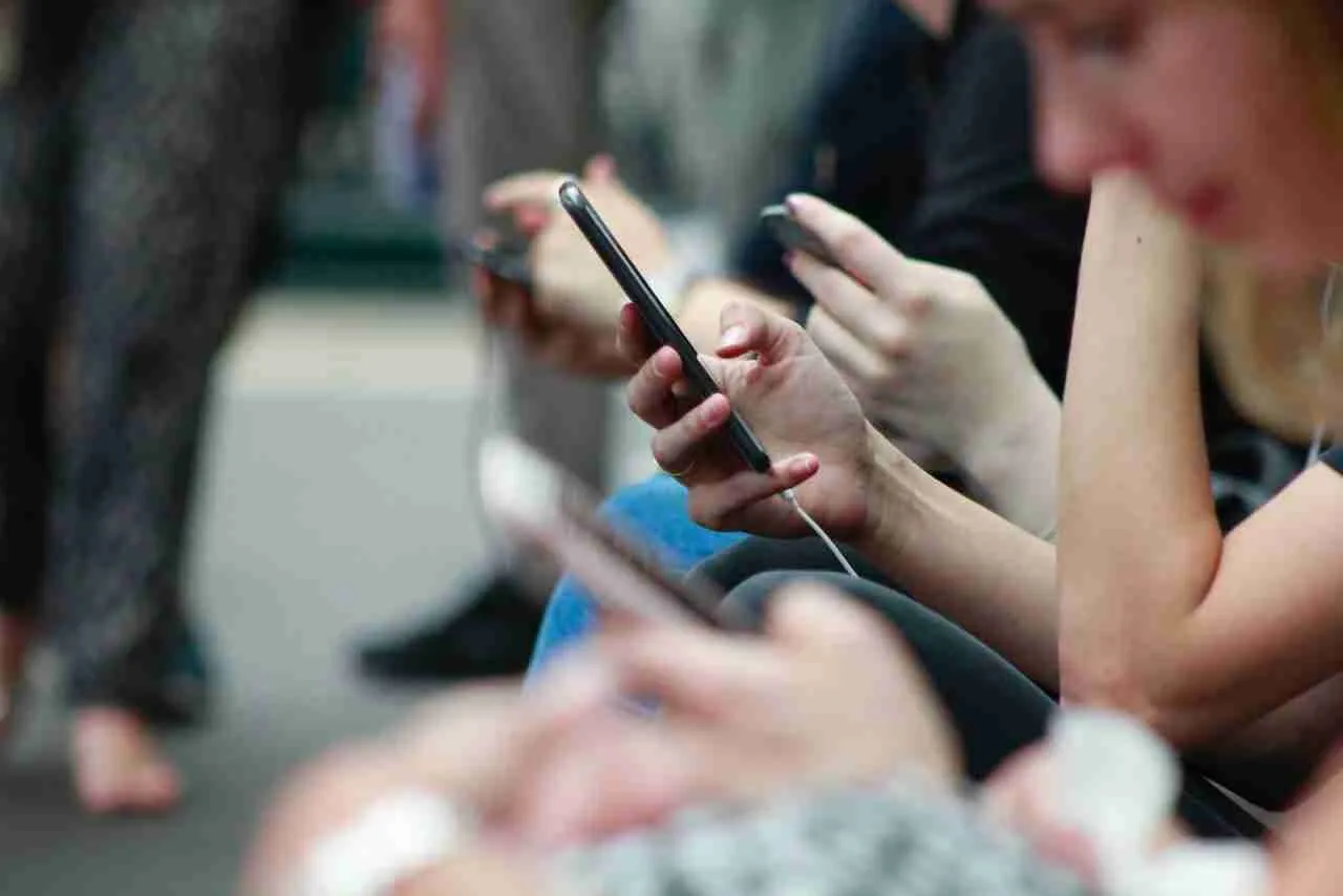 Misinformation on social media: people looking at their phones