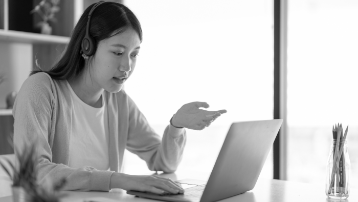 Woman chatting in front of screen
